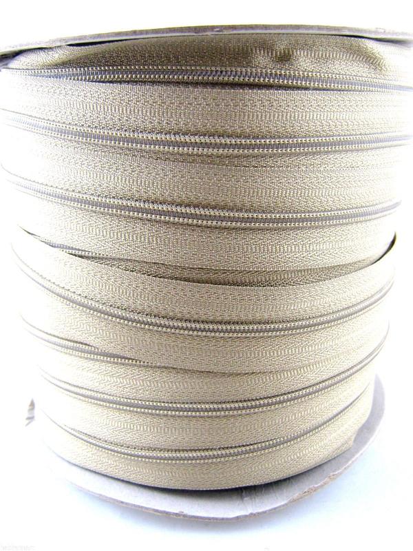 Roll of beige number 5 continuous zip chain on a roll. Front picture