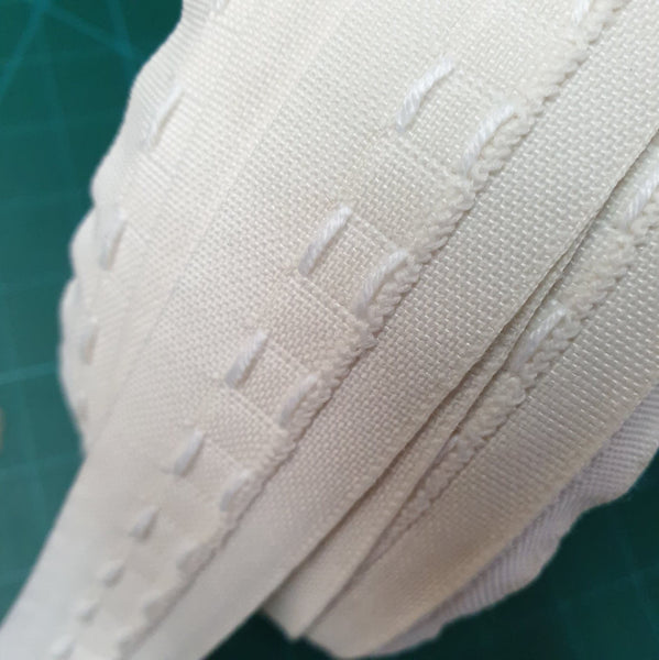 Close-up of a whole roll of cream curtain tape