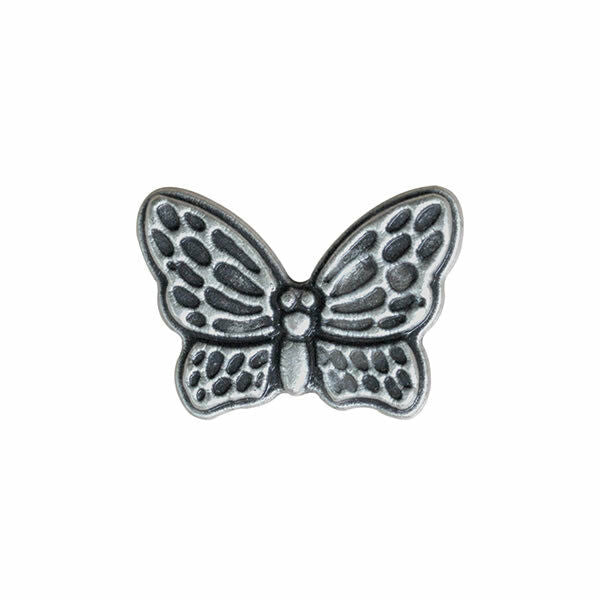 Silver butterfly-shaped decorative item on a white background