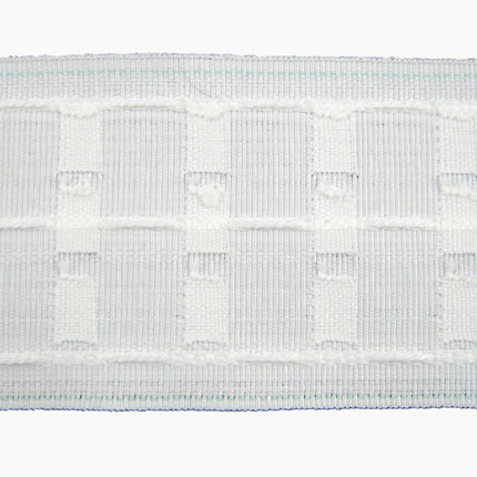Close-up of a three inch premium curtain tape on a white background