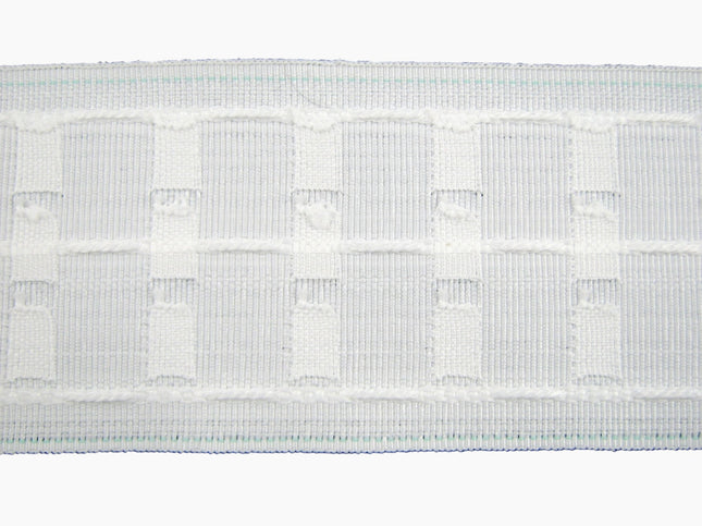 Close-up of a three inch premium curtain tape on a white background