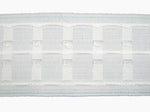 Close-up of a three inch premium curtain tape on a white background