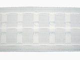 Close-up of a three inch premium curtain tape on a white background