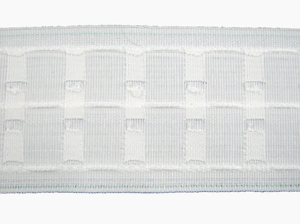 Close-up of a three inch premium curtain tape on a white background
