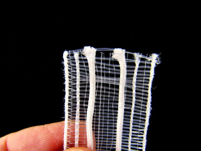 A close-up of transparent Austrian blind tape, showing its texture and weave.