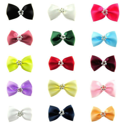 Satin Ribbon Bows With Pearl Ring in various colours uniformly arranged on a white background
