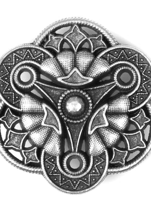 A single antique silver-coloured metal shank button with a floral shape and intricate detailing.
