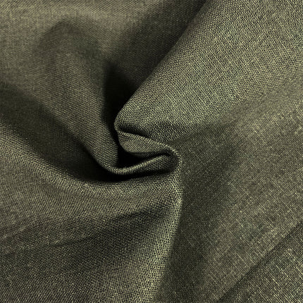 A close-up of draped olive green fabric with a visible woven texture, showing soft folds and shadows.