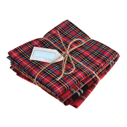 Stack of red plaid tartan fabric fat quarters with twine and a label on a white background