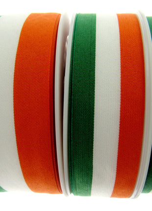 Rolls of green, white, and orange striped ribbons arranged side by side.