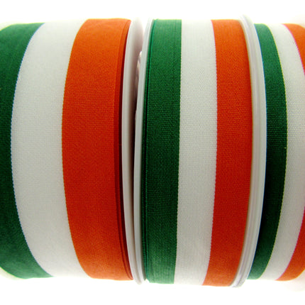 Rolls of green, white, and orange striped ribbons arranged side by side.