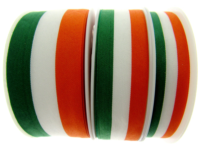 Rolls of green, white, and orange striped ribbons arranged side by side.