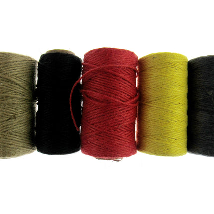 A collection of natural jute rope twine in three colors: beige, red, and green, displayed side by side.