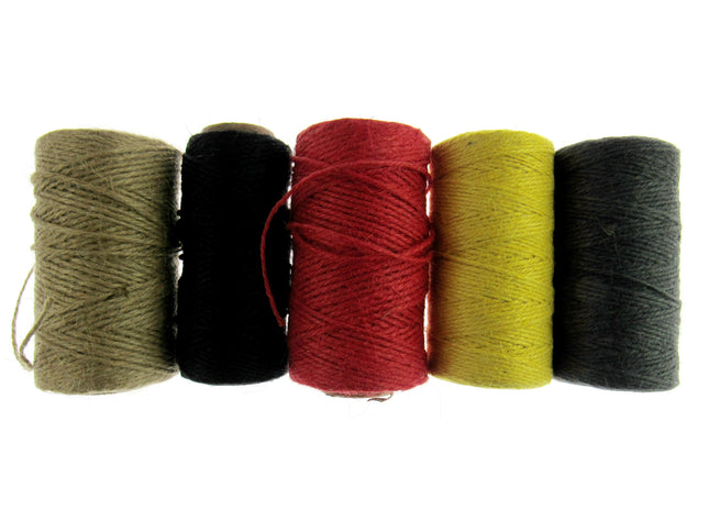 A collection of natural jute rope twine in three colors: beige, red, and green, displayed side by side.