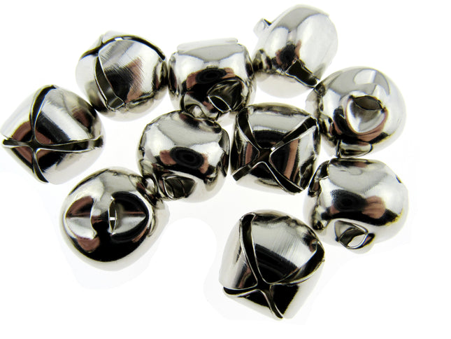 A pile of small shiny silver bells with a polished metallic finish, arranged on a plain white background.
