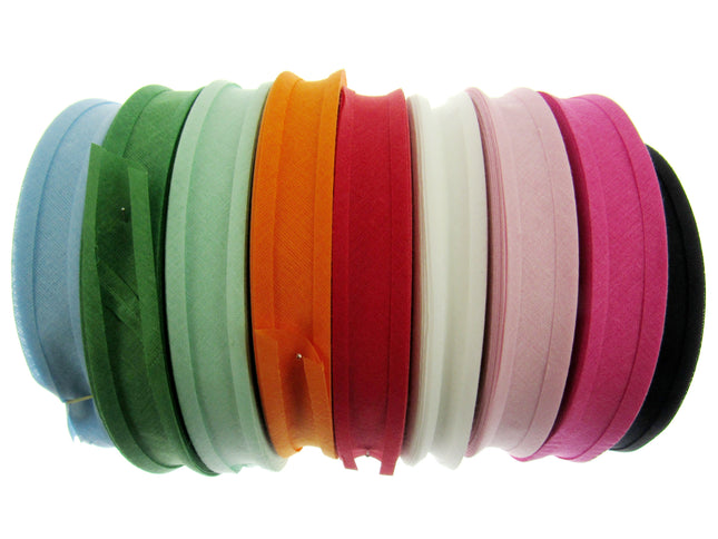A collection of cotton bias binding bunting tape in various solid colors, including blue, green, orange, pink, white, and black, displayed side by side.