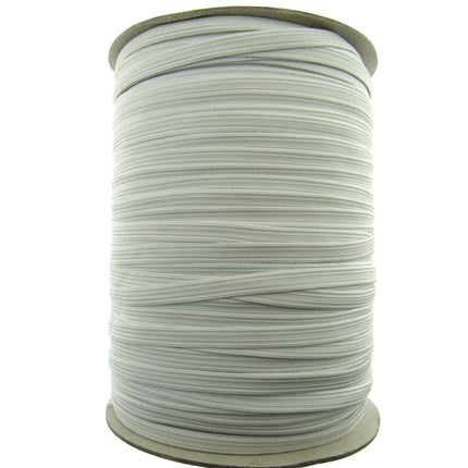 A spool of white elastic cord wound tightly around a cardboard core, shown against a plain white background.