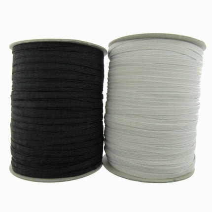 Two spools of elastic cord, one black and one white, shown side-by-side on a plain white background.