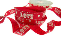 Red ribbon with 'LOVE' and heart patterns on a white background