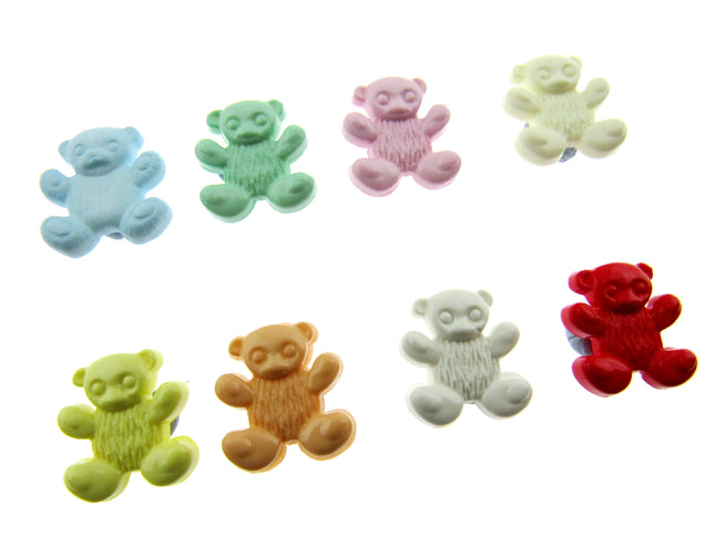 Assorted colorful teddy bear-shaped candies on a white background