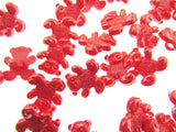 Red gummy bears on a white background