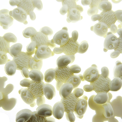 White teddy bear-shaped candies on a white background