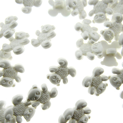 White teddy bear buttons on a white background