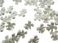 White teddy bear buttons on a white background