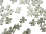 White teddy bear buttons on a white background