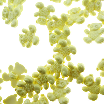 Yellow teddy bear buttons on a white background