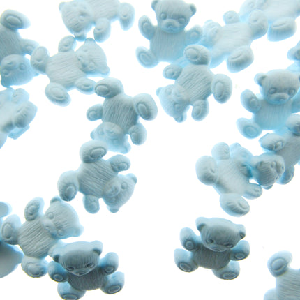 Blue teddy bear-shaped buttons scattered on a white background