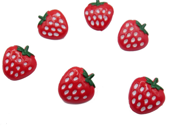 Red strawberry-shaped buttons with green stems on a white background