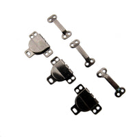 Set of metal skirt hooks on a white background