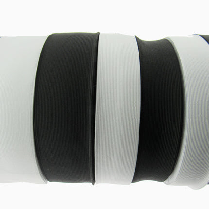 Black and white flat woven elastic on a white background