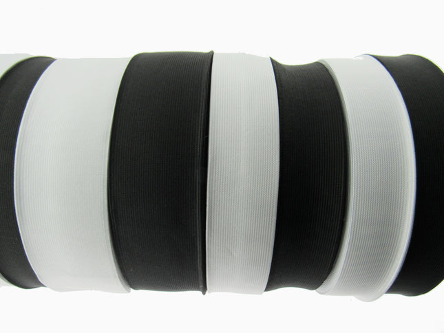 Black and white flat woven elastic on a white background