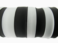 Black and white flat woven elastic on a white background