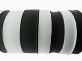 Black and white flat woven elastic on a white background
