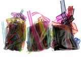 Colorful lengths of chiffon ribbon in clear bags on a white background