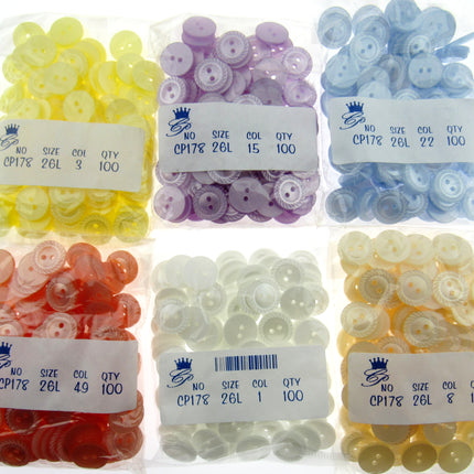 Assorted buttons in clear plastic bags with labels on a white background