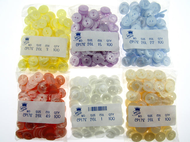 Assorted buttons in clear plastic bags with labels on a white background