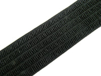 Close-up of a black woven waspie elastic on a white background