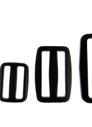 Black Delrin Plastic sliders on a white background