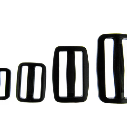 Black Delrin Plastic sliders on a white background