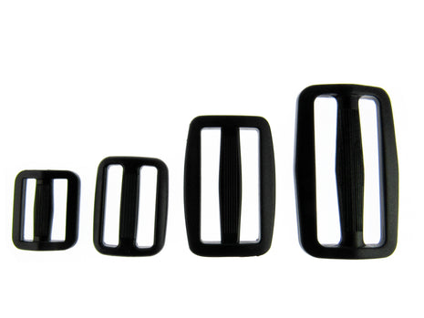 Black Delrin Plastic sliders on a white background