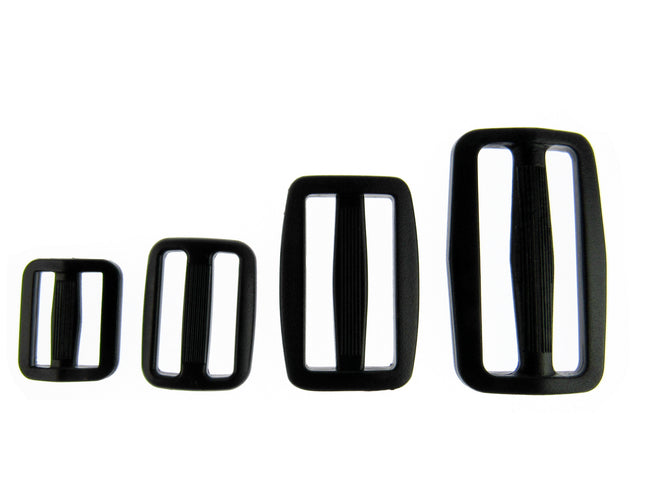 Black Delrin Plastic sliders on a white background