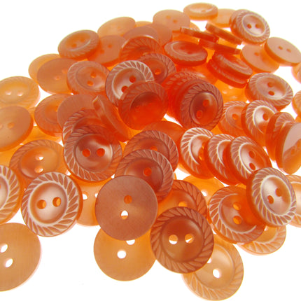 Collection of orange buttons with a white background