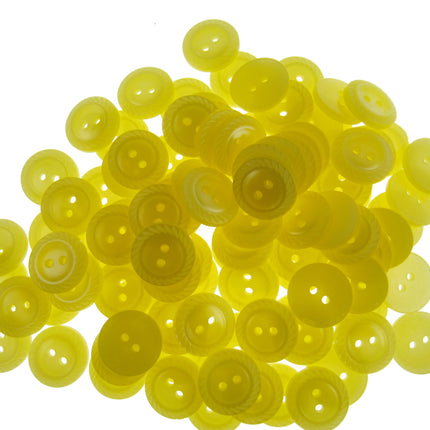 Pile of yellow buttons on a white background