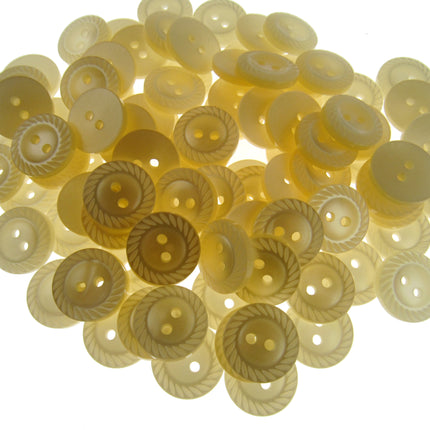 Collection of light-colored buttons on a white background