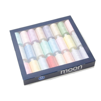 Set of pastel-colored sewing thread in a box with 'moon' branding on a white background