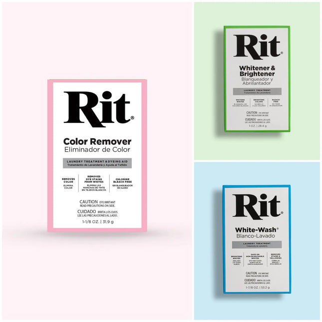 Three Rit laundry treatment packets arranged on a pastel background: a larger pink-bordered packet labeled Color Remover on the left, and two smaller packets with green and blue borders labeled Whitener & Brightener and White-Wash on the right.